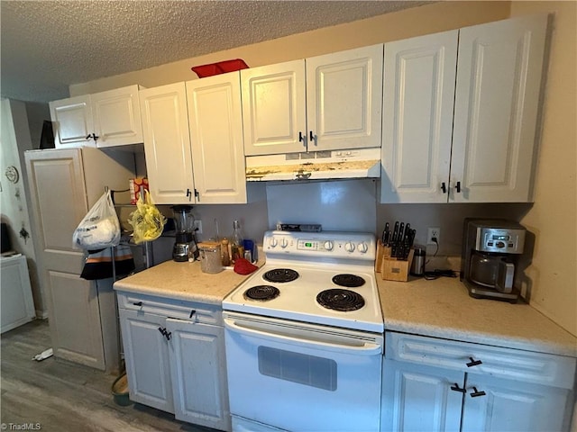 kitchen featuring white cabinetry, wood-type flooring, a textured ceiling, and white electric range