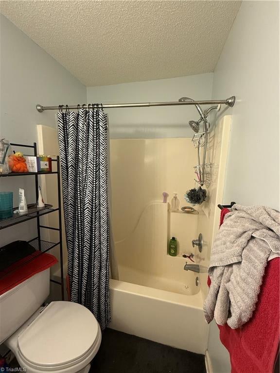 bathroom featuring a textured ceiling, toilet, and shower / bath combo with shower curtain