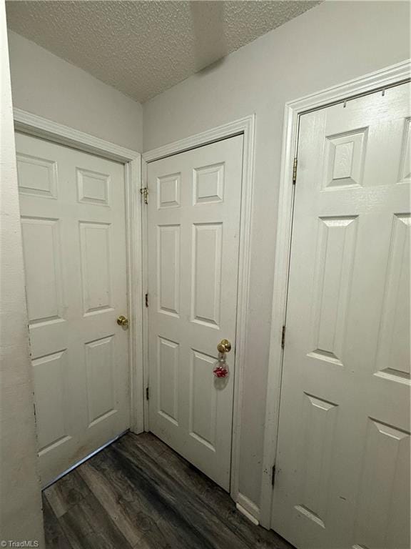 room details featuring wood-type flooring and a textured ceiling