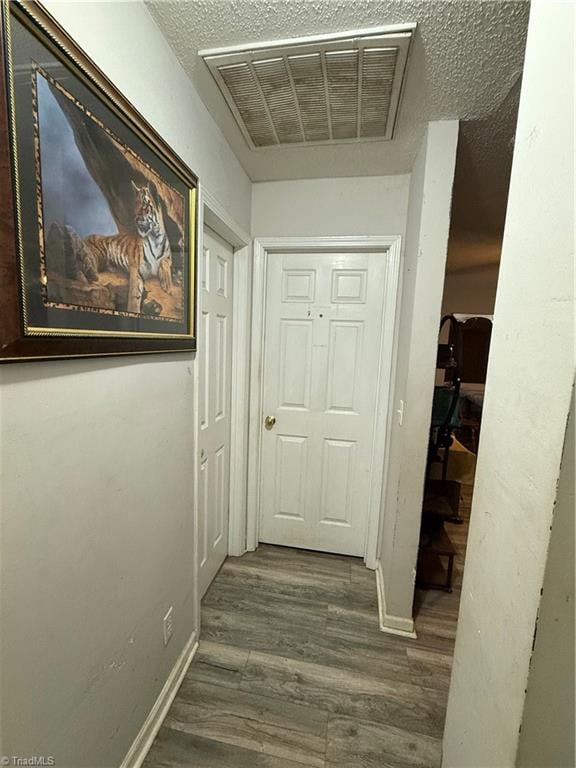 hall featuring dark hardwood / wood-style flooring