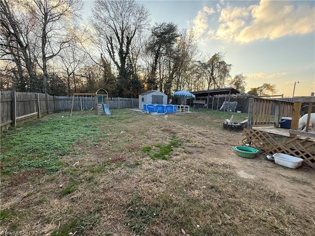 yard at dusk with a playground