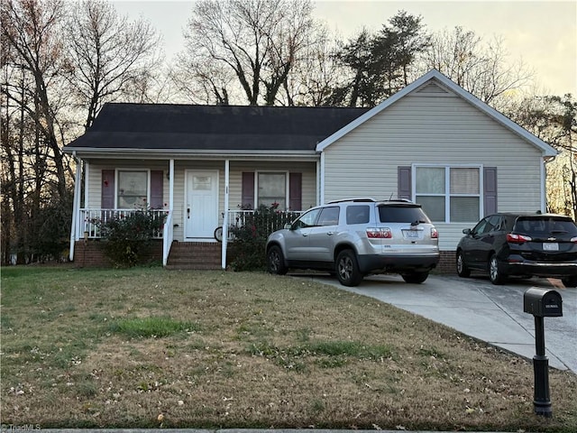 view of front of property with a front lawn and a porch