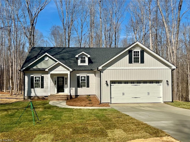 view of front of property with concrete driveway, a garage, a front yard, and crawl space