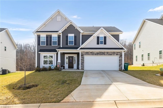 craftsman inspired home with a garage, a front lawn, and central air condition unit