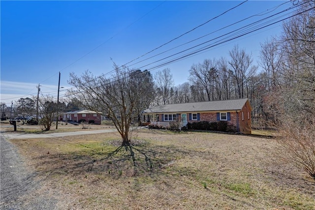 view of front of property featuring brick siding