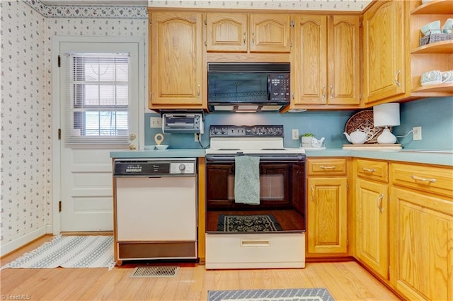 kitchen with wallpapered walls, electric stove, dishwasher, black microwave, and open shelves