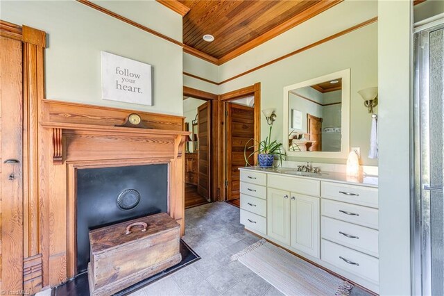 bathroom featuring ornamental molding, wooden ceiling, and vanity