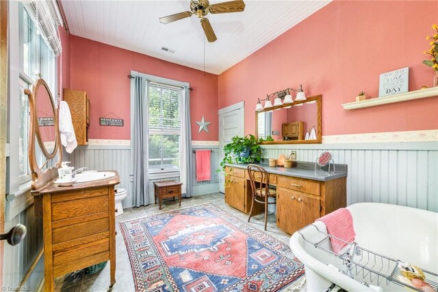 home office featuring wood-type flooring, sink, and ceiling fan