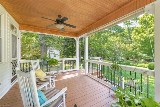 deck with a porch and ceiling fan