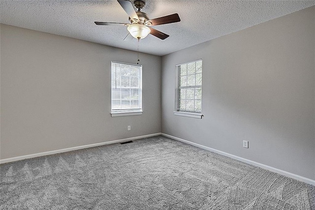 5948 Muddy Creek Rd, Archdale, NC 27263 - spare room with a ceiling fan, carpet flooring, a textured ceiling, and baseboards