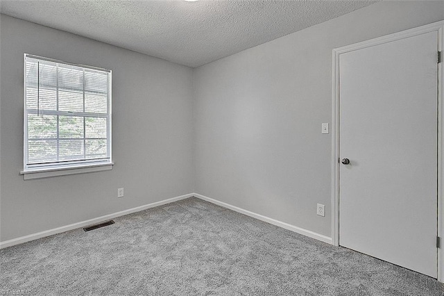 5948 Muddy Creek Rd, Archdale, NC 27263 - carpeted spare room featuring a textured ceiling and baseboards