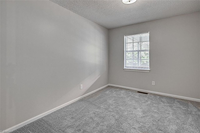 5948 Muddy Creek Rd, Archdale, NC 27263 - unfurnished room with carpet flooring, a textured ceiling, and baseboards