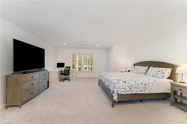 bedroom with recessed lighting, light colored carpet, and baseboards