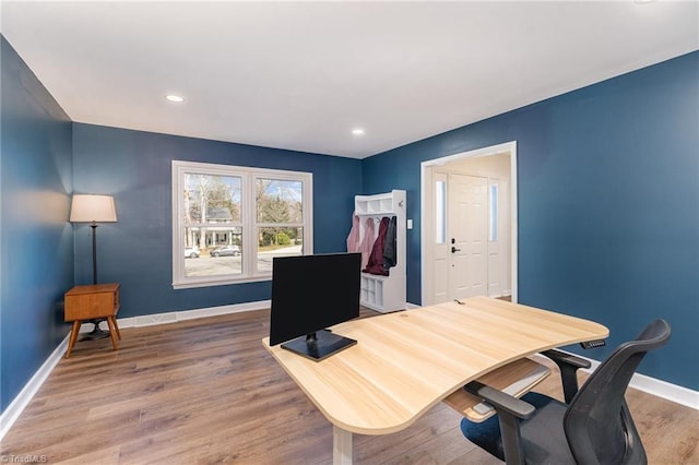 home office featuring baseboards, wood finished floors, and recessed lighting