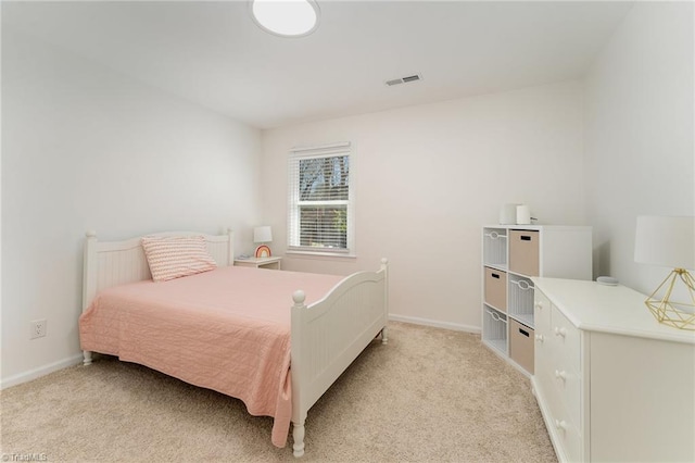 bedroom with light carpet, baseboards, and visible vents