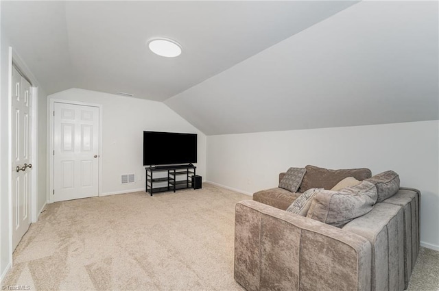 living room featuring light carpet, lofted ceiling, visible vents, and baseboards