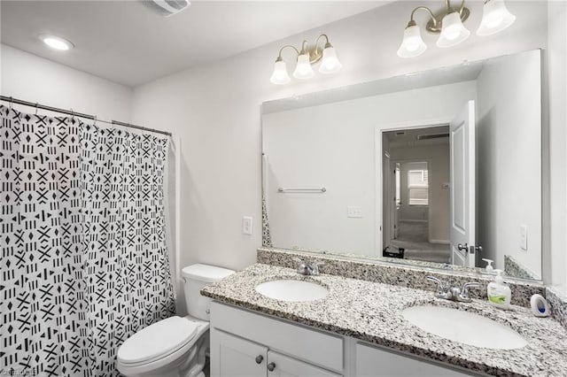 635 Cam Cir, High Point, NC 27265 - bathroom with toilet, double vanity, and a shower with shower curtain