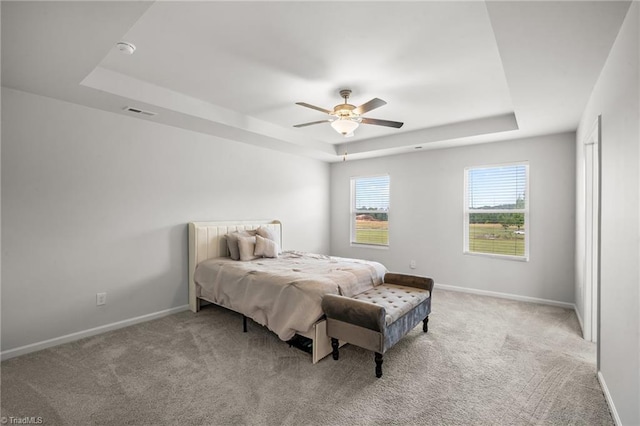 635 Cam Cir, High Point, NC 27265 - bedroom with a raised ceiling, light carpet, and baseboards