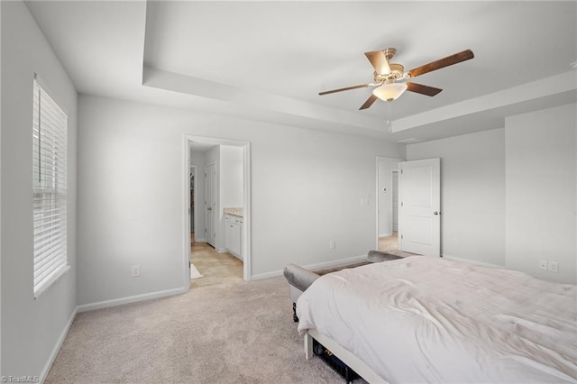 635 Cam Cir, High Point, NC 27265 - bedroom featuring a tray ceiling, baseboards, multiple windows, and light colored carpet