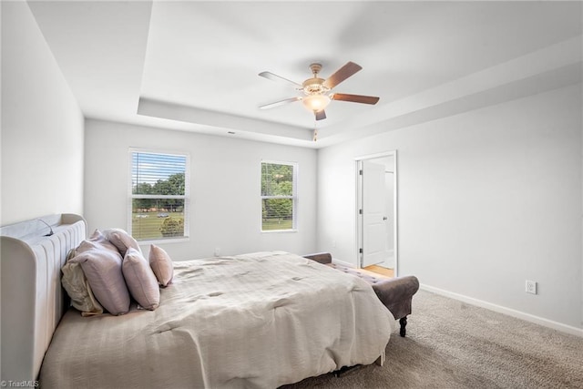 635 Cam Cir, High Point, NC 27265 - bedroom featuring a tray ceiling, baseboards, and ceiling fan