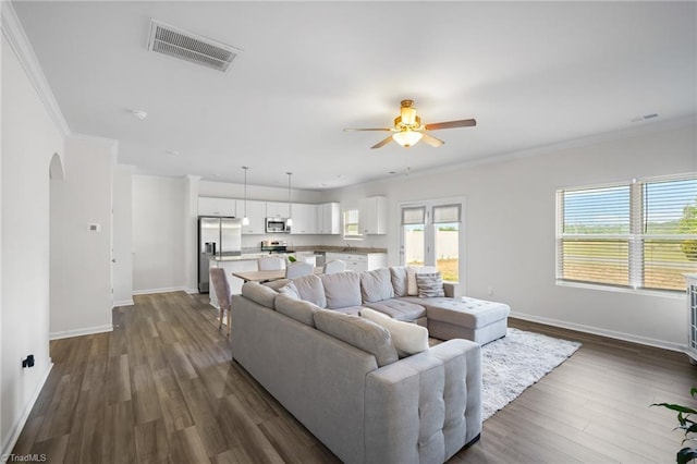 635 Cam Cir, High Point, NC 27265 - living area featuring arched walkways, ceiling fan, baseboards, dark wood-style floors, and crown molding