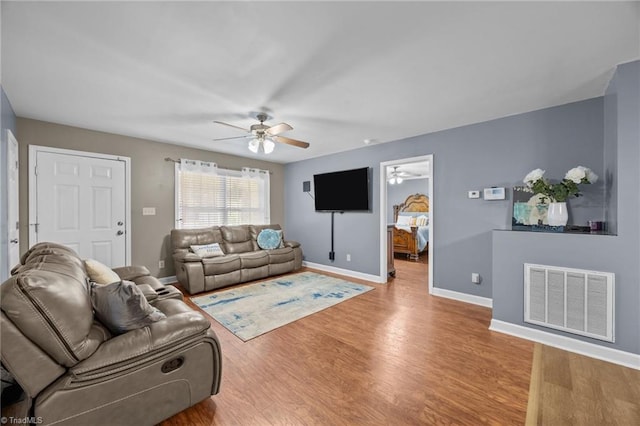 6953 Flint Hill Rd, Sophia, NC 27350 - living room featuring ceiling fan and wood finished floors