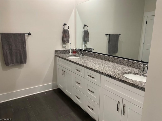 bathroom featuring tile patterned flooring and vanity