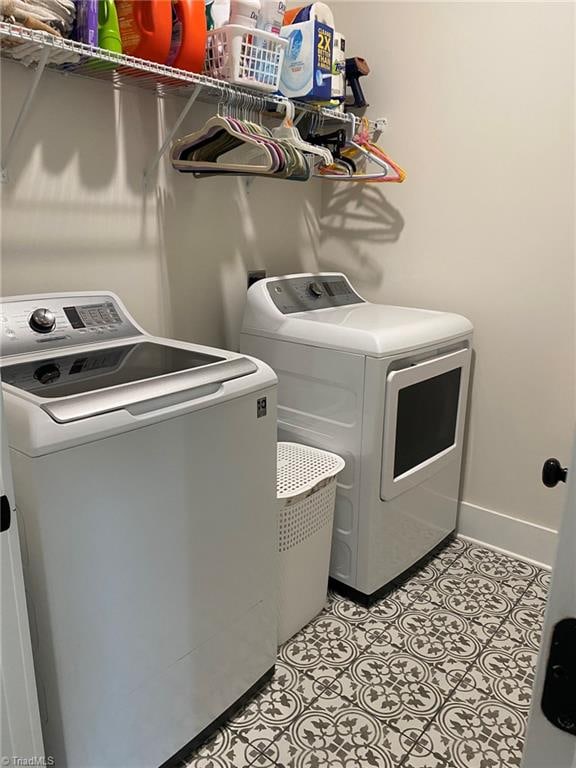 clothes washing area featuring washer and clothes dryer