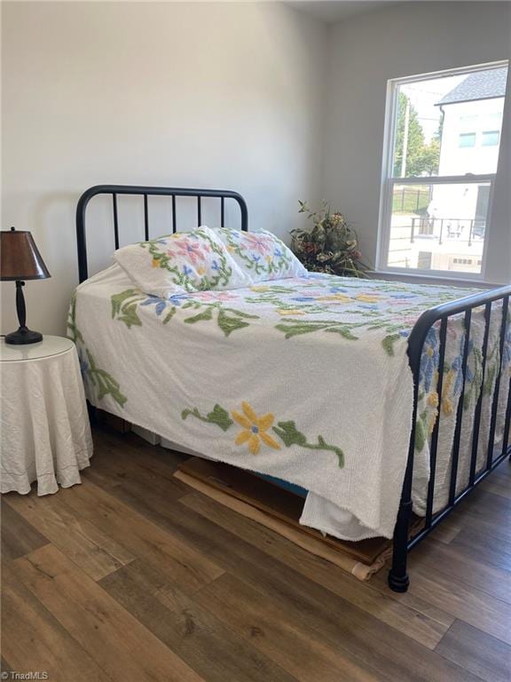 bedroom featuring dark wood-type flooring