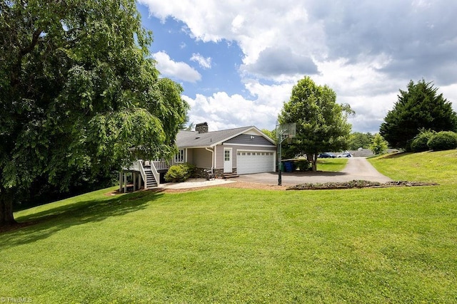 123 Greenbriar St, Mount Airy, NC 27030 - view of grassy yard featuring an attached garage, concrete driveway, and stairway