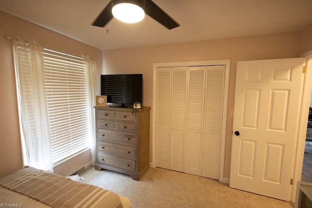 123 Greenbriar St, Mount Airy, NC 27030 - bedroom with a closet, light colored carpet, a ceiling fan, and multiple windows
