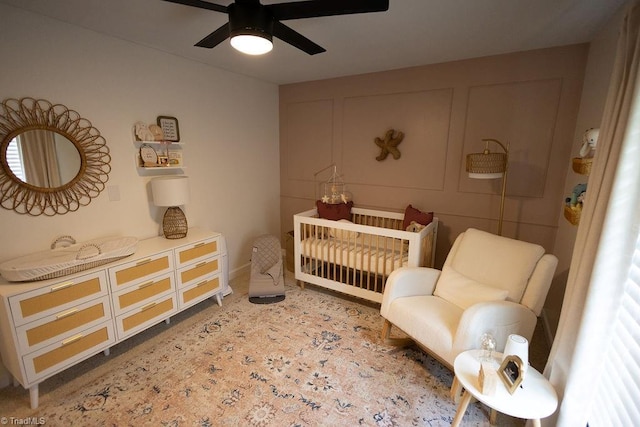 123 Greenbriar St, Mount Airy, NC 27030 - bedroom with a crib and ceiling fan