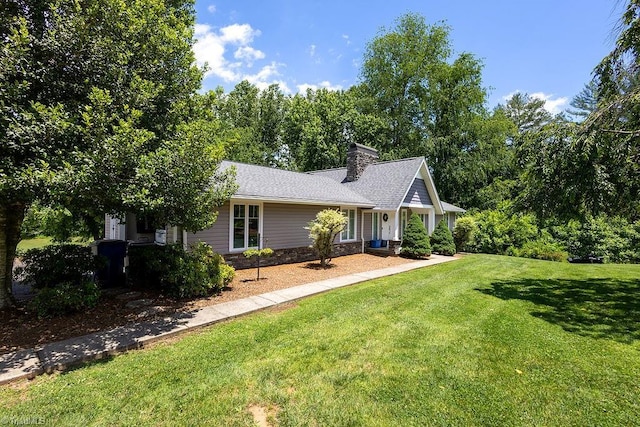 123 Greenbriar St, Mount Airy, NC 27030 - view of front of house featuring a front lawn, a chimney, and stone siding
