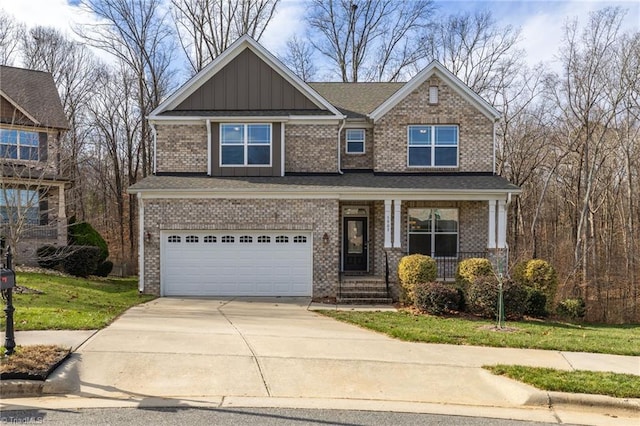 craftsman-style home featuring covered porch, a garage, and a front lawn