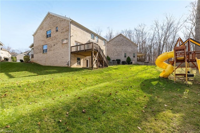 view of yard featuring a playground and a wooden deck