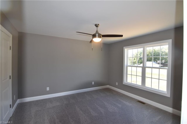 carpeted empty room with ceiling fan