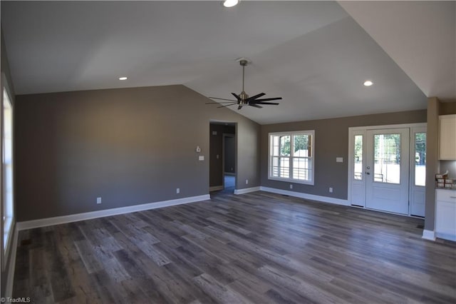 unfurnished living room featuring ceiling fan, lofted ceiling, and dark wood-type flooring