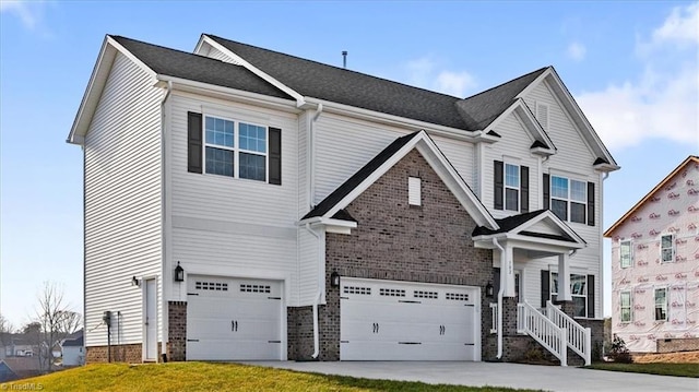 view of front of home featuring a garage and a front yard