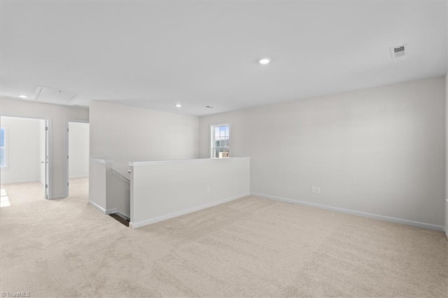 unfurnished room with light colored carpet