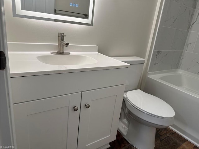 bathroom with hardwood / wood-style flooring, vanity, and toilet