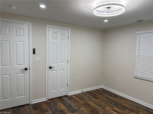 spare room featuring dark hardwood / wood-style floors