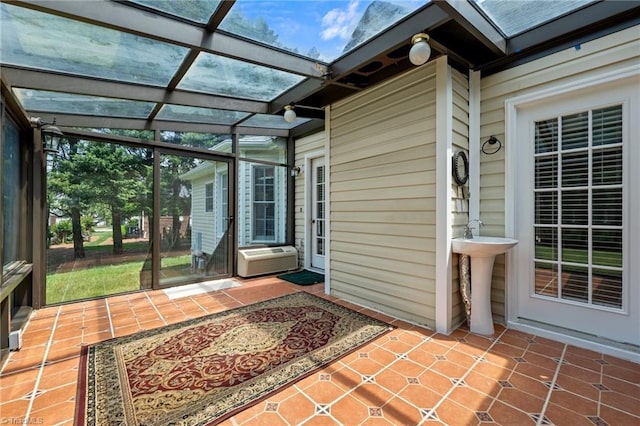 view of patio / terrace with a sink, a pergola, and cooling unit