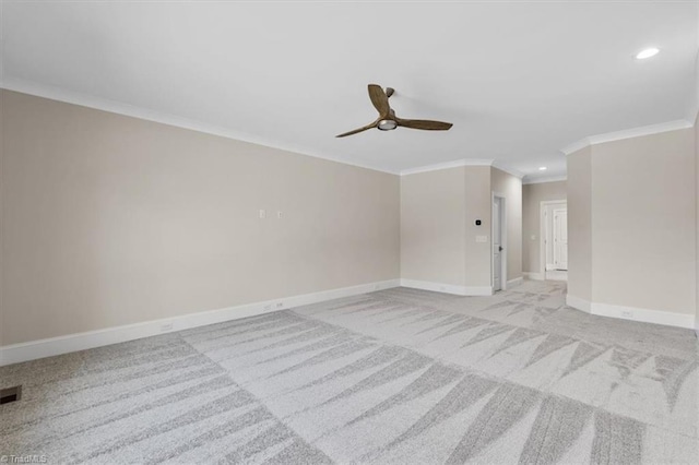 spare room with visible vents, crown molding, baseboards, light carpet, and recessed lighting