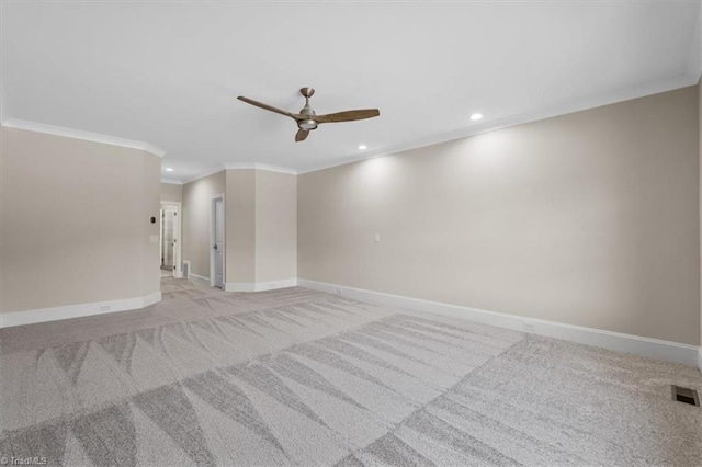 spare room featuring recessed lighting, baseboards, light colored carpet, and ornamental molding