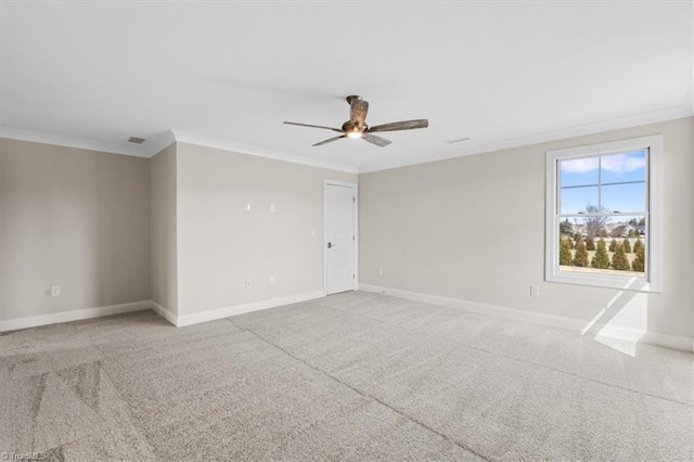 empty room featuring ceiling fan, light colored carpet, baseboards, and ornamental molding