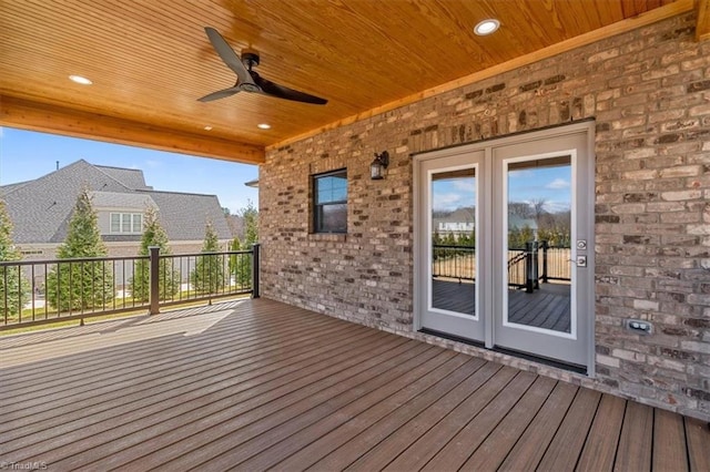 wooden terrace featuring ceiling fan