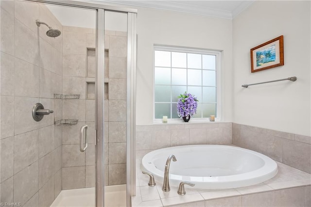 bathroom featuring ornamental molding and shower with separate bathtub