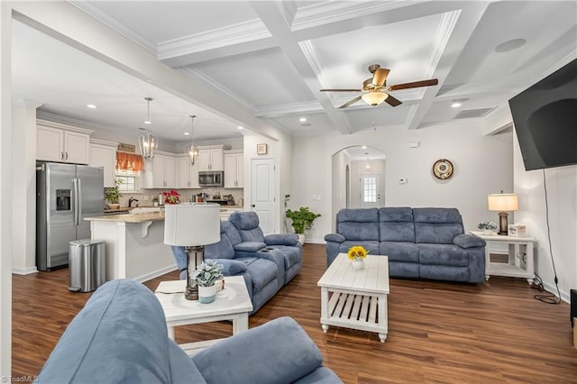 living room featuring beam ceiling, ceiling fan, coffered ceiling, dark hardwood / wood-style flooring, and crown molding