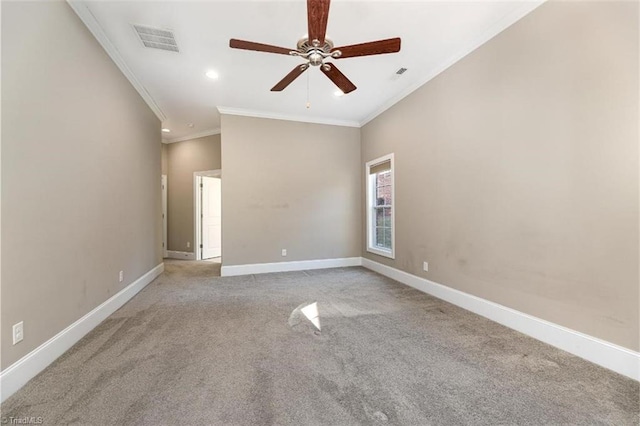 unfurnished room with ceiling fan, visible vents, baseboards, crown molding, and light colored carpet