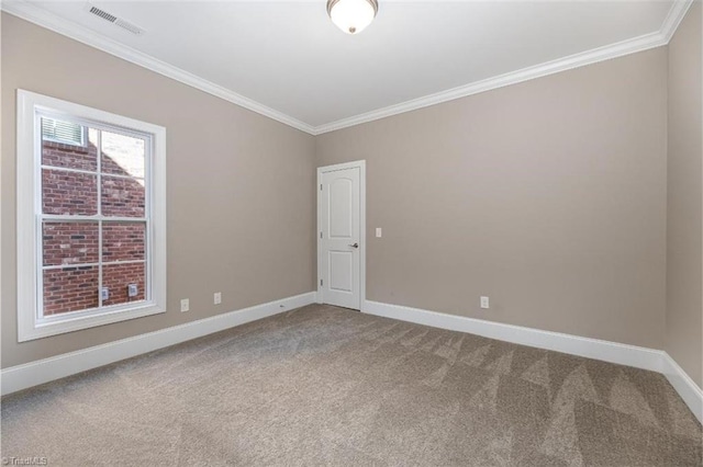 carpeted empty room featuring crown molding, visible vents, and baseboards